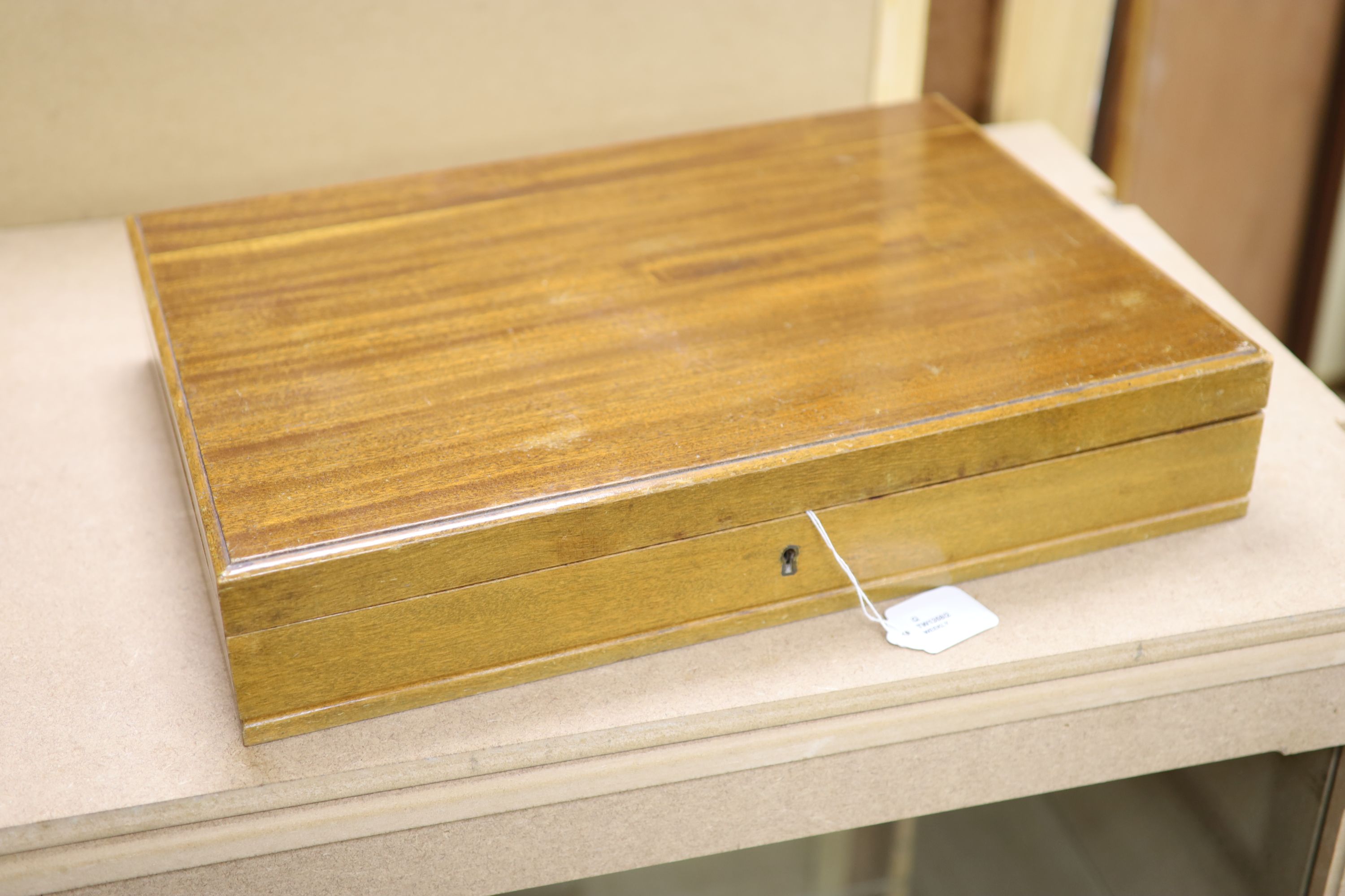 A Garrard & Co service of plated flatware in mahogany canteen, a pair of plated bottle coasters and a plated tray